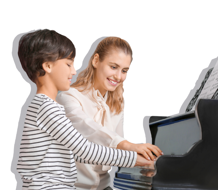 Teacher and child practicing playin on piano